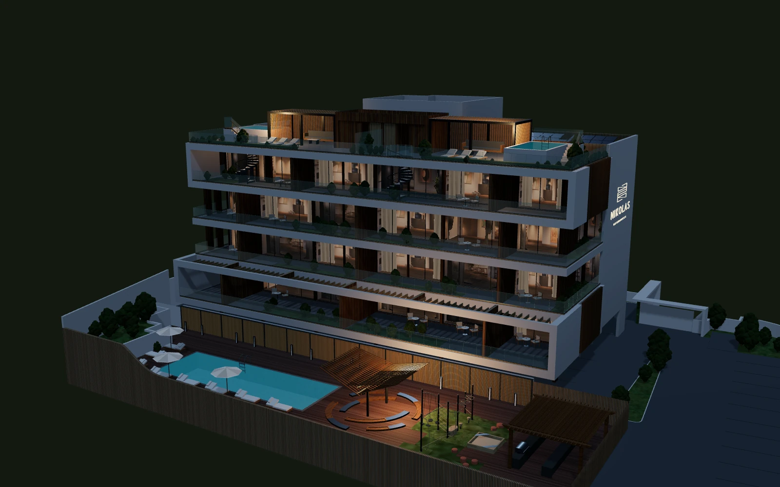 Nicolas Residences after dark, with illuminated interiors and swimming pools